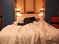 Christy basks in our hotel bed 2